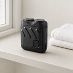 Rotary Electric Shaver for Men, Dual-Ring Blade Water-Resistant Grooming Razor, shown beside a folded towel for scale