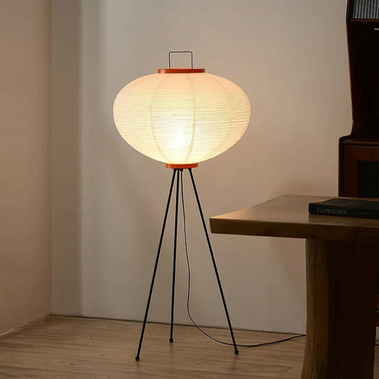 Minimalist soft diffused floor lamp with rice paper shade and tripod design front view