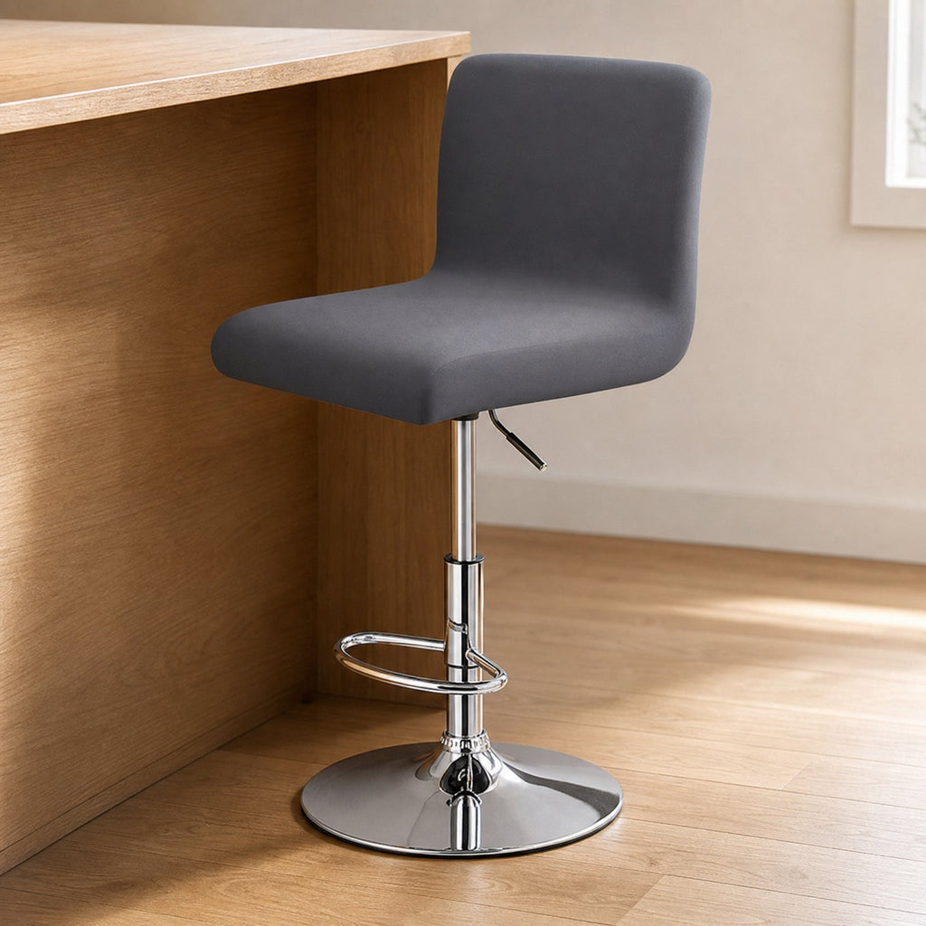Stretch Bar Stool Covers, Waterproof Elastic Seat Slipcover for Round & Square Stools, fitted to a low-back bar stool at a wood breakfast bar