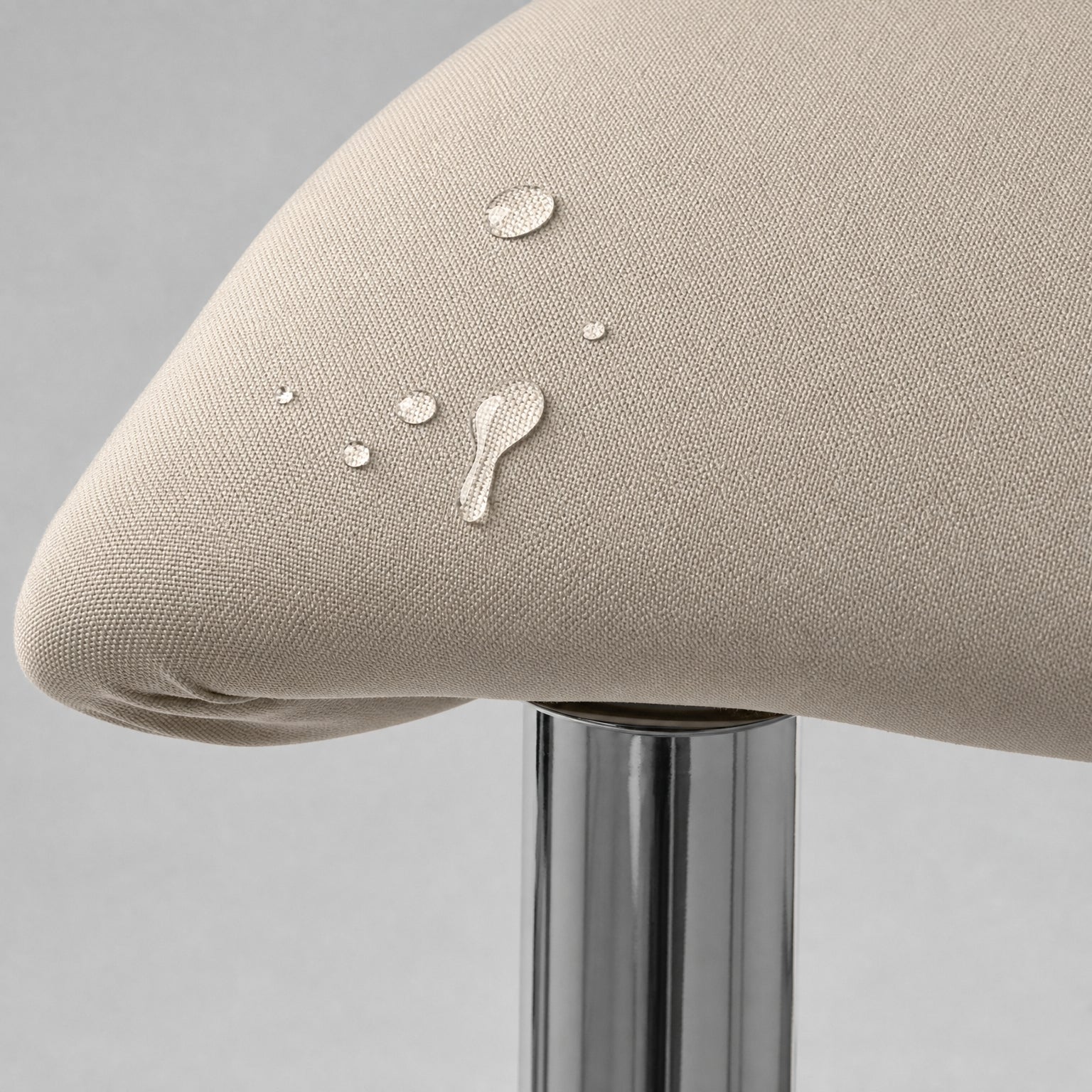 Close view of the Stretch Bar Stool Covers, Waterproof Elastic Seat Slipcover for Round & Square Stools tucked clean at the front seat corner