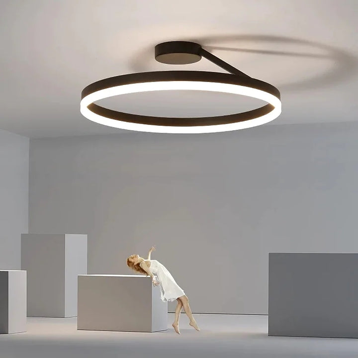 Modern offset circular LED ceiling light by Ridorn