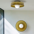 Round glass flush ceiling light fixture for indoor spaces