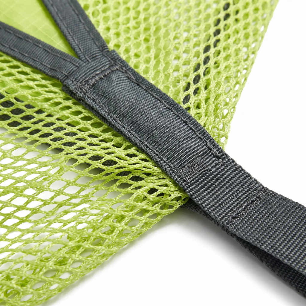 Close-up of a lime green mesh fabric of the hammock with a dark gray adjustable strap, shown on a white background.