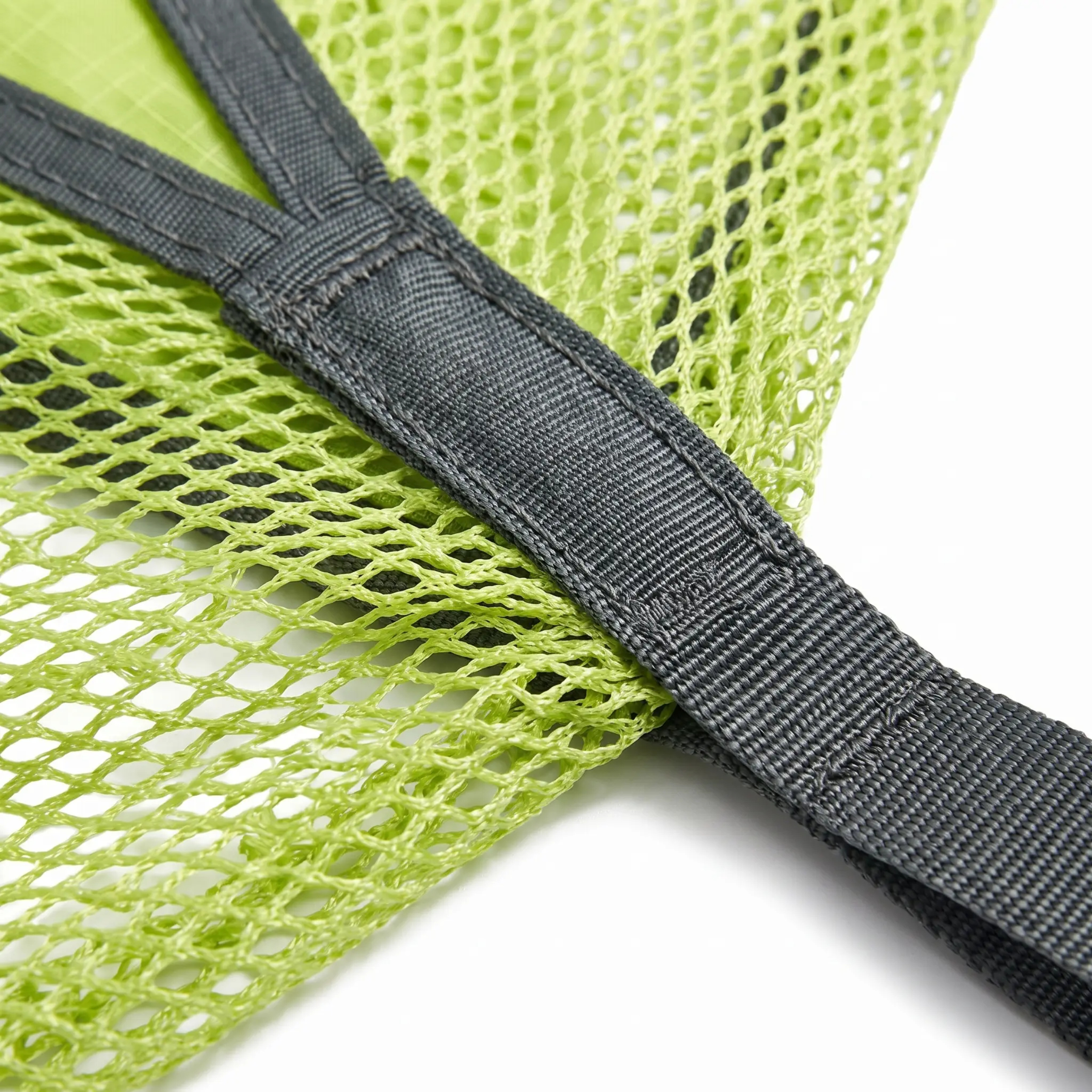 Close-up of a lime green mesh fabric of the hammock with a dark gray adjustable strap, shown on a white background.